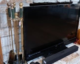 Fireplace accessories, television (Vizio 47") and Sony Sound Bar