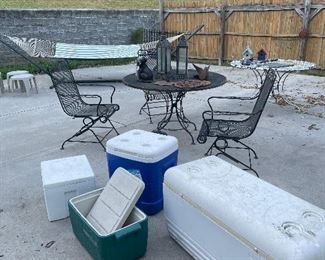 wrought iron table, chairs, glider, side tables, cools, hammock, garden pots, garden iron decorations