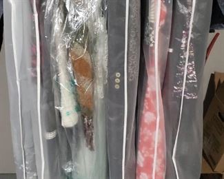 Over 100 Ladys Designer dresses, skirts, pants and more. Size 4.