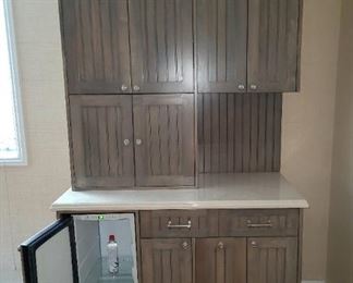 Large cabinet with built in mini fridge. 36 in wide, 8 ft tall