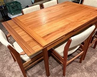 Beautiful Danish Modern Teak Table with Leaves on each end by Mobler Made in Denmark with 6 Upholstered Teak Chairs.