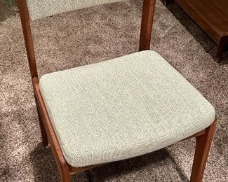 Beautiful Danish Modern Teak Table with Leaves on each end by Mobler Made in Denmark with 6 Upholstered Teak Chairs.