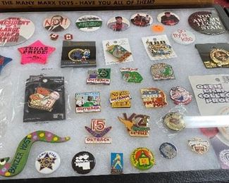 Flat of Outback Pins and Assorted Pinback Collectibles