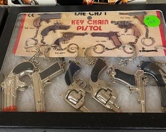 Flat with Assorted Toy Pistol Keychains