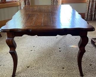 French Provincial Extension Dining Table. Measures 71 - 110" L x 44" W x 30" H with 24" Clearance. Has Two 20” Leaves. Photo 1 of 4.