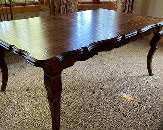 French Provincial Extension Dining Table. Measures 71 - 110" L x 44" W x 30" H with 24" Clearance. Has Two 20” Leaves. Photo 2 of 4.