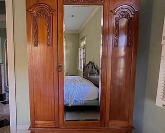 Antique Cherry Mirror-Front Wardrobe / Armoire. Measures 45’ W x 17” D x 78” H. Photo 1 of 2.