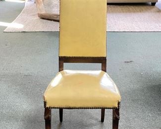 Pair of 2 Antique Leather Upholstered Dining Chairs with Nailhead Trim and Carved Cartouche. Each Measures 18” W x 17” D x 44” H with 18” Seat Height. Photo 1 of 4.