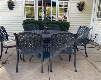Brown Jordan Wrought Iron Tagle and 6 Chair Set.