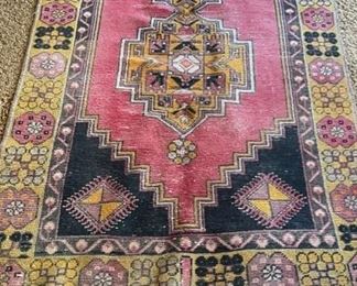 Vintage Persian Rug. Measures 6’ 8” x 3’ 3”.