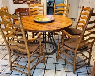 Great kitchen set. Set of six caned back chairs (likely Chaddock). Butcher block table top with iron base.