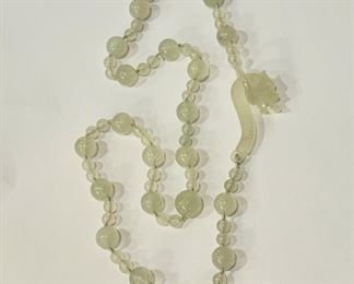 Jade bead necklace with dragon closure