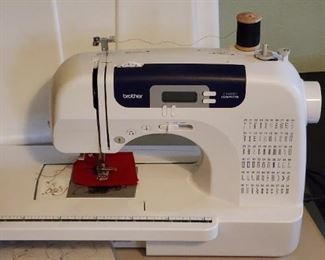 Brother 6000i Computerized sewing machine with accessories and case