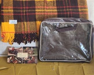 Vintage Faribo "Robe in a Bag" fluff-loomed fringe stadium blanket with original bag, vintage ad and vinyl rain cover.