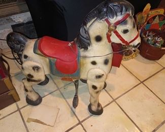 Vintage / antique ride on metal horse still works