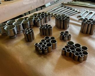 Multiple sets of craftsman sockets and wrenches in both metric and standard sizes