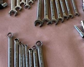 Multiple sets of craftsman sockets and wrenches in both metric and standard sizes