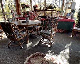 Porch room with table and chair set and holiday decor