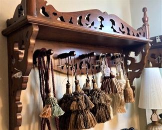 Antique shelf; tassels 