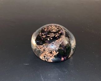Small black paperweight signed by Sam