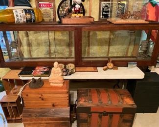 Large Wood/glass vintage display cabinet (measures 8' L x 28" T x 15" D) antique wood trunk, wooden Army green box, miniature wooden threshing machine in glass case and assorted breweriana, signage.