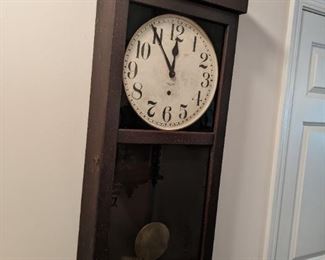Austere vintage mahogany body wall clock, by New Haven Clock Co., w/pendulum. 