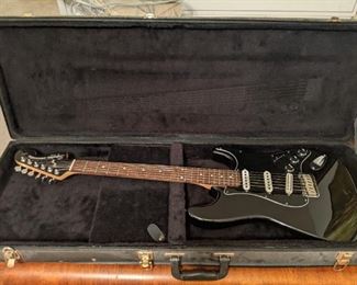 Vintage Fender Squier Stratocaster electric guitar, standard series, serial number IC0409333033, made in Indonesia, with case.