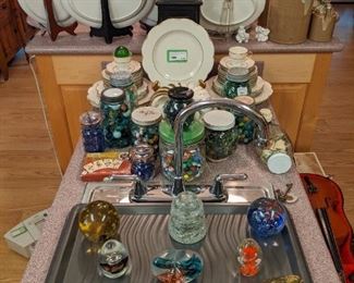 42-piece set of Theodore Haviland "Concorde" china, several old bottles filled with vintage marbles, collection of glass paperweights and vintage German alarm clock, in faux leather case. 