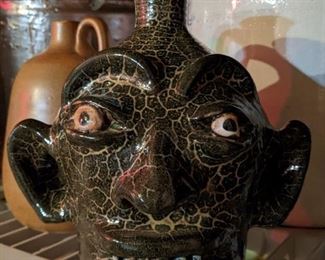 Goofy glazed pottery face jug by known artist, Marvin Bailey, of Kershaw, NC.