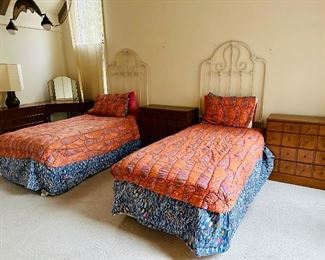 Twin beds with metal headboards