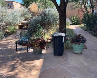 Pair of these black chairs available and so many beautiful pots!