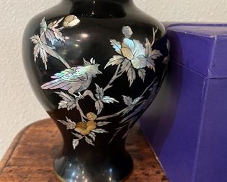 Black enamel, brass, and mother of pearl vase with case