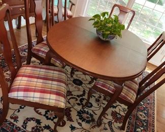 Dining table with 8 chairs, pads and 2 leaves, by Harden. 64x43 with two 16 inch leaves. $795.00