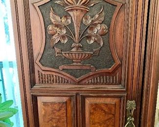 Additional photo of Armoire carved doors and brass hardware.