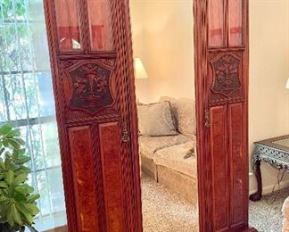 Beautiful Mahogany Knockdown Armoire. Carved doors, beveled mirror and beveled glass. Measures 56" wide x 19" depth x 88" tall.