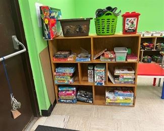 Lego Table. board games like Topple, Scrabble, Matching and Memory games. Battleship board game. Card games and flash cards. Large marble race game. Train sets. Duplos. Monopoly. Game of Life. Elementary board games. 