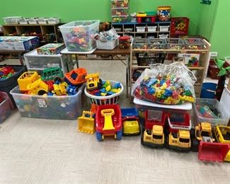 Lots of different types of trucks and sand toys. Duplos and Mega Blocks. HUGE SELECTION!