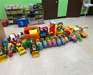 HUGE SELECTION of push cars, trucks, little people play sets, car tracks, little trike, dump trucks.