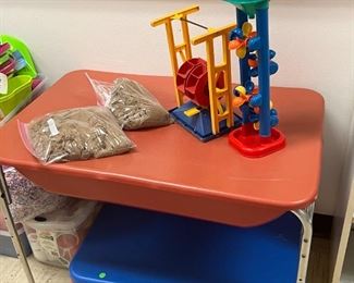 Sand table and lots of sand toys and different sensory bin materials.