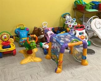 Riding toys and push toys. Baby seats. Play crawl through toy.
