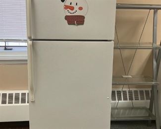 White refrigerator with freezer. Croc pot chicago bears. drink pitcher. small croc pot.  