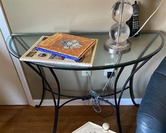 Metal and glass demilune table