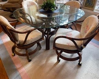 Rattan glass top table with rolling swivel/rocking chairs