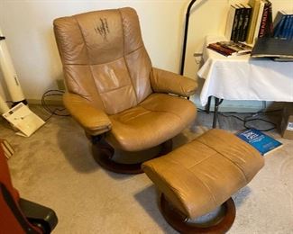 Stress less Kensington recliner and ottoman . Needs a headrest to hide the wear