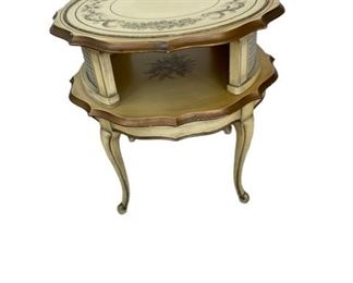 $500 - Round Hand Painted Signed Katherine Henick Side Table CD131-23 Description: Katherine Henick round end table hollywood regency gorgeous round 2-leveled end table. This table emits true hollywood regency design. it comes with a ivory finish and is beautifully hand painted by Katherine Henick (the table is signed on the top). the table is beautifully crafted with a myriad of stunning details, such as the gorgeous flowery and golden paintings or the beautifully wavy design. the table has a round glass top to protect the table top. the end table is in excellent condition (see condition pictures). The table is firm and sturdy. overall it presents beautifully and makes a strong visual statement to any environment.
Condition: Excellent vintage condition.
Dimensions: 27 x 27 x 24 in
Local pickup Leesburg, VA. Contact us for shipper suggestions.