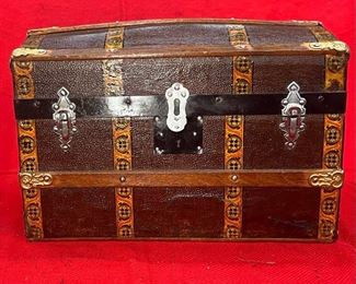 Child’s Camel Back
One of our nicest Children’s trunks. Much like our larger Martin Maier…all original. The very first question you must ask yourself when considering restoration is…do I leave it original or do a total restoration? We only have two that we have not touched. This is a beautiful Child’s trunk for any home or showroom.

*Please note we can ship this item although it is marked pickup only, just know there will be additional costs.

14L x 9D x 10H