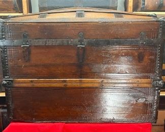 1870's Camel Back Featuring Brass Star Lock
This is a beautiful stamped wooden Camel Back. It has a brass Star lock patent in March 1869 and a latch to the lock with patent dates from May 1854, Feb. 1867, May 1868, and Nov. 1870. We know that it was possibly built within 10 years of 1870. Hinges are not attached and no handles, but plenty of space inside this large trunk.

*Please note we can ship this item although it is marked pickup only, just know there will be additional costs.

36L x 21D x 28H