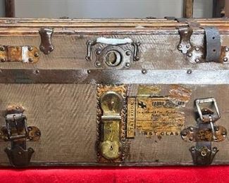 1/2 Trunk With Corbin Lock & Hardware
This could be considered either a half a trunk or even a Steamer trunk which must be under 18 inches tall to slide underneath the bunk. This canvas is in good shape with plenty of travel stickers to show that it has been quite a few places. A very nice Corbin lock and hardware makes this ½ trunk look pretty solid.

34L x 20D x 12L

*Please note we can ship this item although it is marked pickup only, just know there will be additional costs.