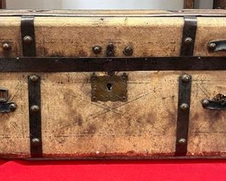1800's Small Jenny Lind Trunk
A stamped heavy paper covers this Jenny Lind trunk with the original 2 ban with brass buttons on them. Jenny Lind was known as the Swedish Nightingale who came to America with PT Barnum and stole America’s heart in 1850. Most people believe that Jenny Linds were made in and after 1850 but they can be traced back to the 1830s in England. Many things were made using her name such as beds, highchairs, and including Jenny Lind Cabins that were insulated with paper. It still has its brass lock plate and lock, but not the latch. It also has Eagle stamped handle end caps. All original.

*Please note we can ship this item although it is marked pickup only, just know there will be additional costs.

26L x 14D x 13H