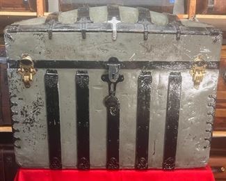 1880's Camel Back Featuring John Sessions Hardware
A real nice Camel Back with some unusual cross like hardware on top, along with John Sessions hardware on the rest. A round pad lock by F.W. Mix patented in 1880. J. H. Sessions bolts (latches). Very deep for a lot of storage and would be a real nice, restored piece for storage at the end of one’s bed.

*Please note we can ship this item although it is marked pickup only, just know there will be additional costs.

35L x 21D x 28H